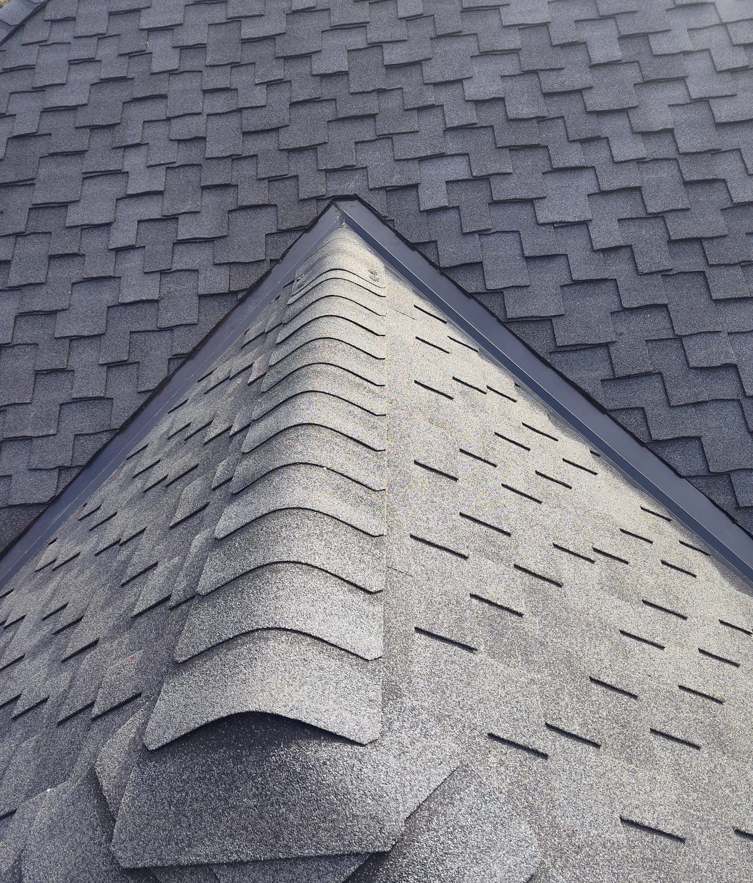 Close view of the layered hip cap on the charcoal Presidential Shake designer shingle roof in Ocean Springs