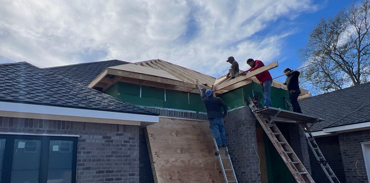 The crew re-decking the raised front elevation of the Ocean Springs home in January before the front was re-roofed