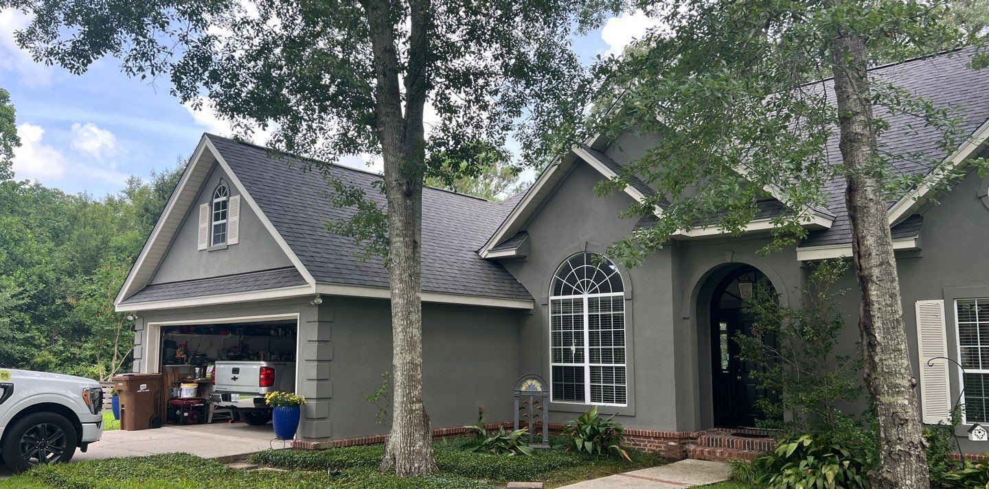Front and garage of the Biloxi home under the completed Georgetown Gray FORTIFIED roof
