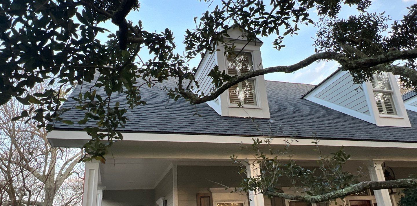 Front porch and both dormers of the Gulfport home under the 25-year-old charcoal shingle roof at the December estimate visit