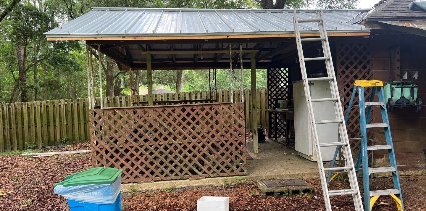 The office lean-to in Ocean Springs finished with a new metal roof while the crew was on site