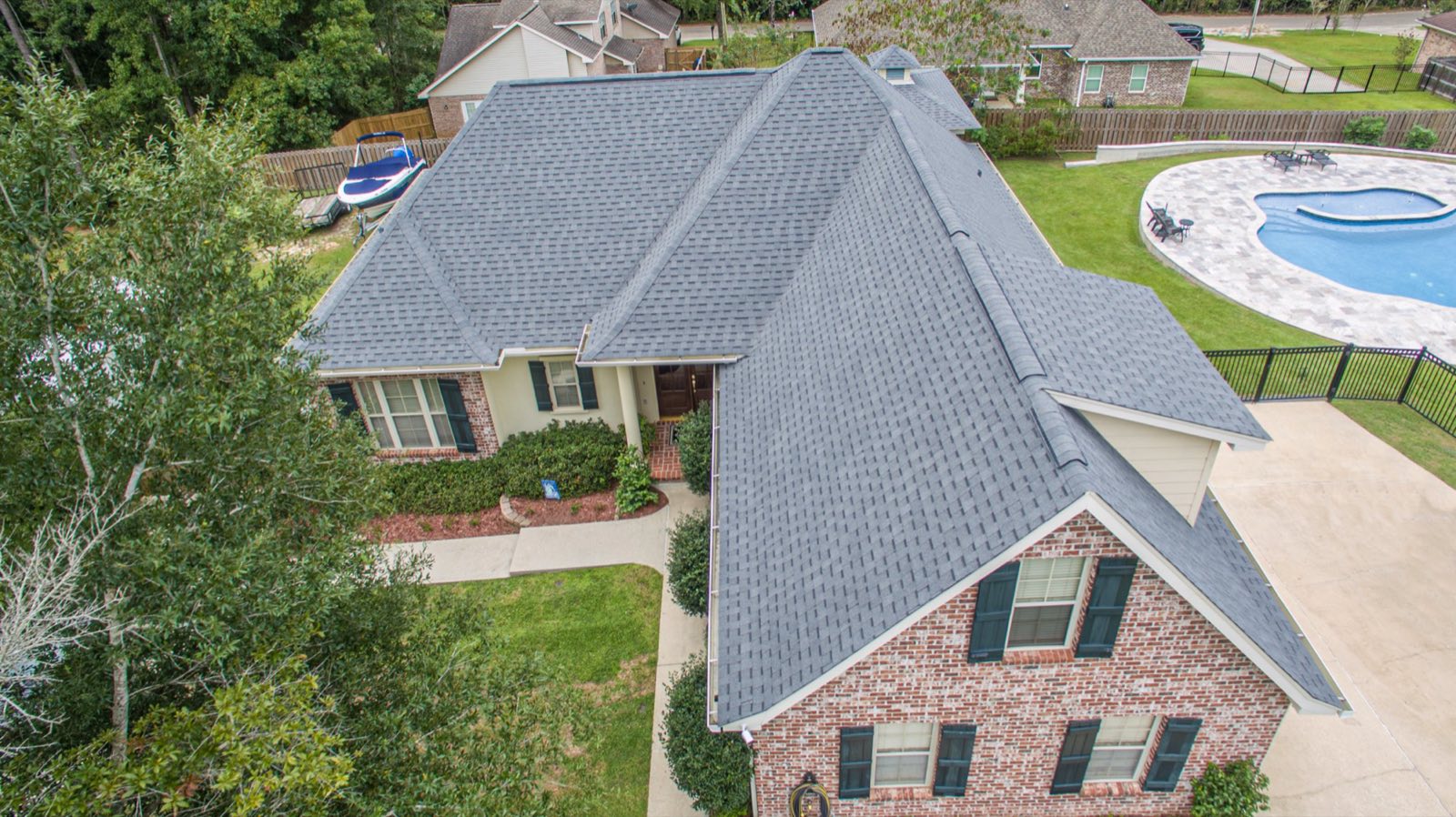 Drone aerial of a completed architectural shingle roof replacement by Gulf South Roofing in Diamondhead Mississippi