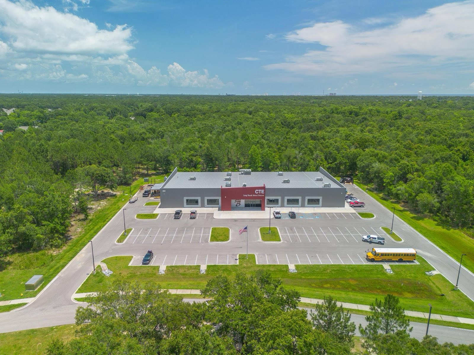 Aerial of the Long Beach School District CTE building with its metal roof installed by Gulf South Roofing