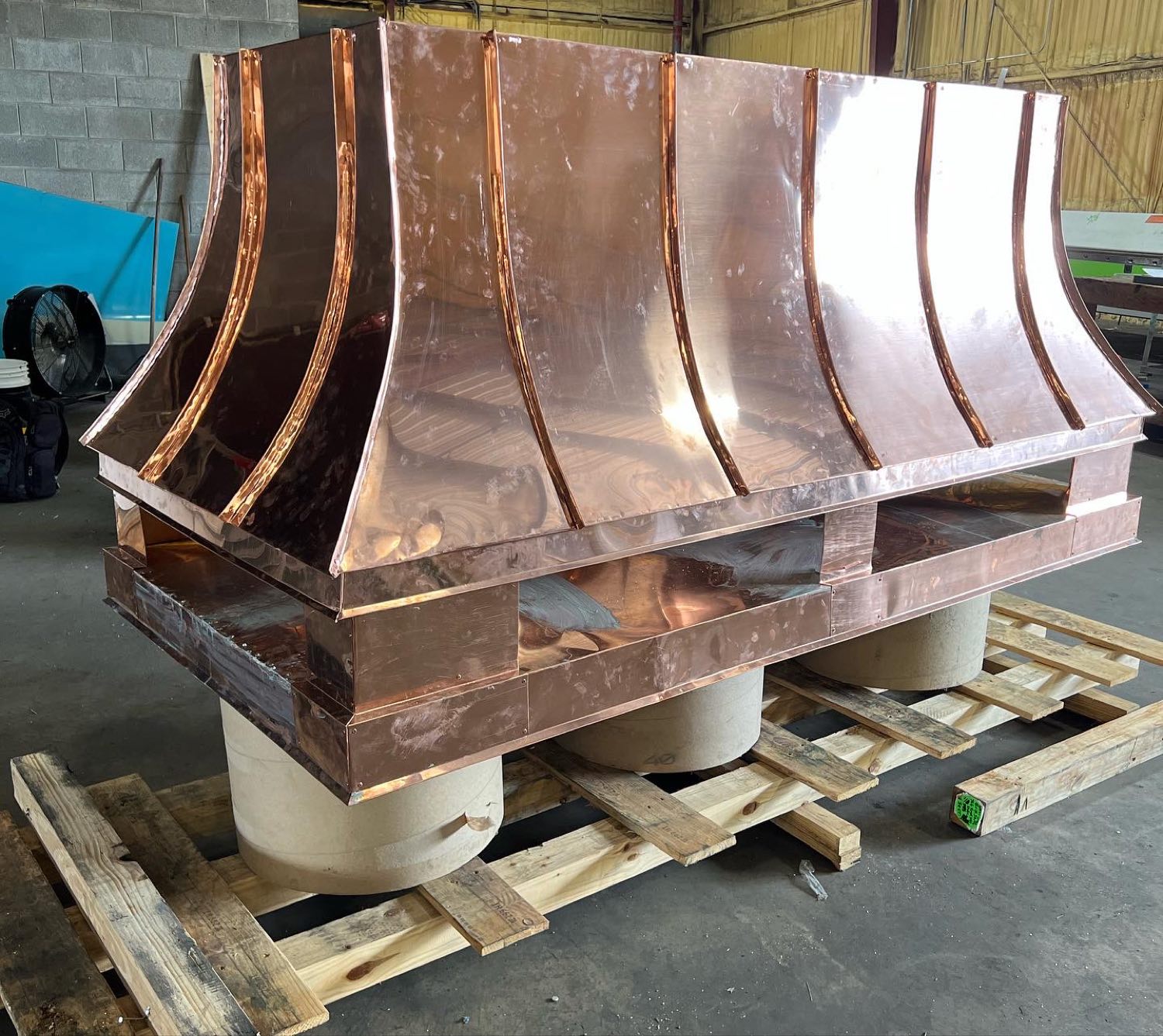 Copper chimney hood assembly nearly complete at the Gulf South Roofing shop
