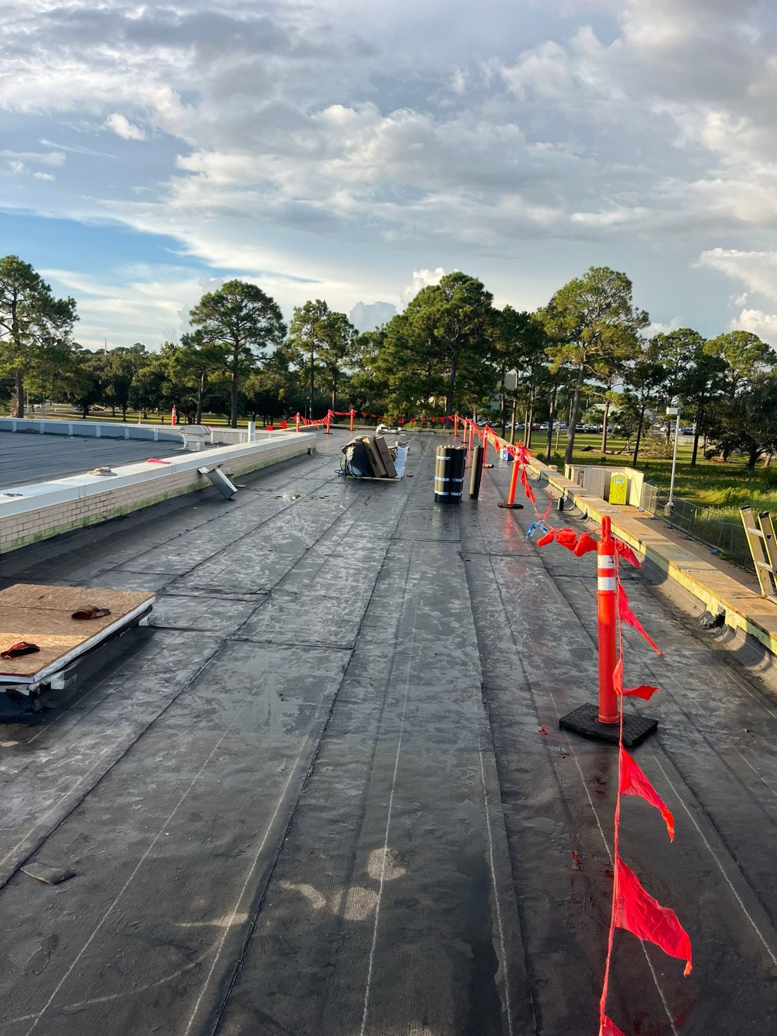 Commercial flat roof prepared for membrane with safety flags on the Mississippi Gulf Coast