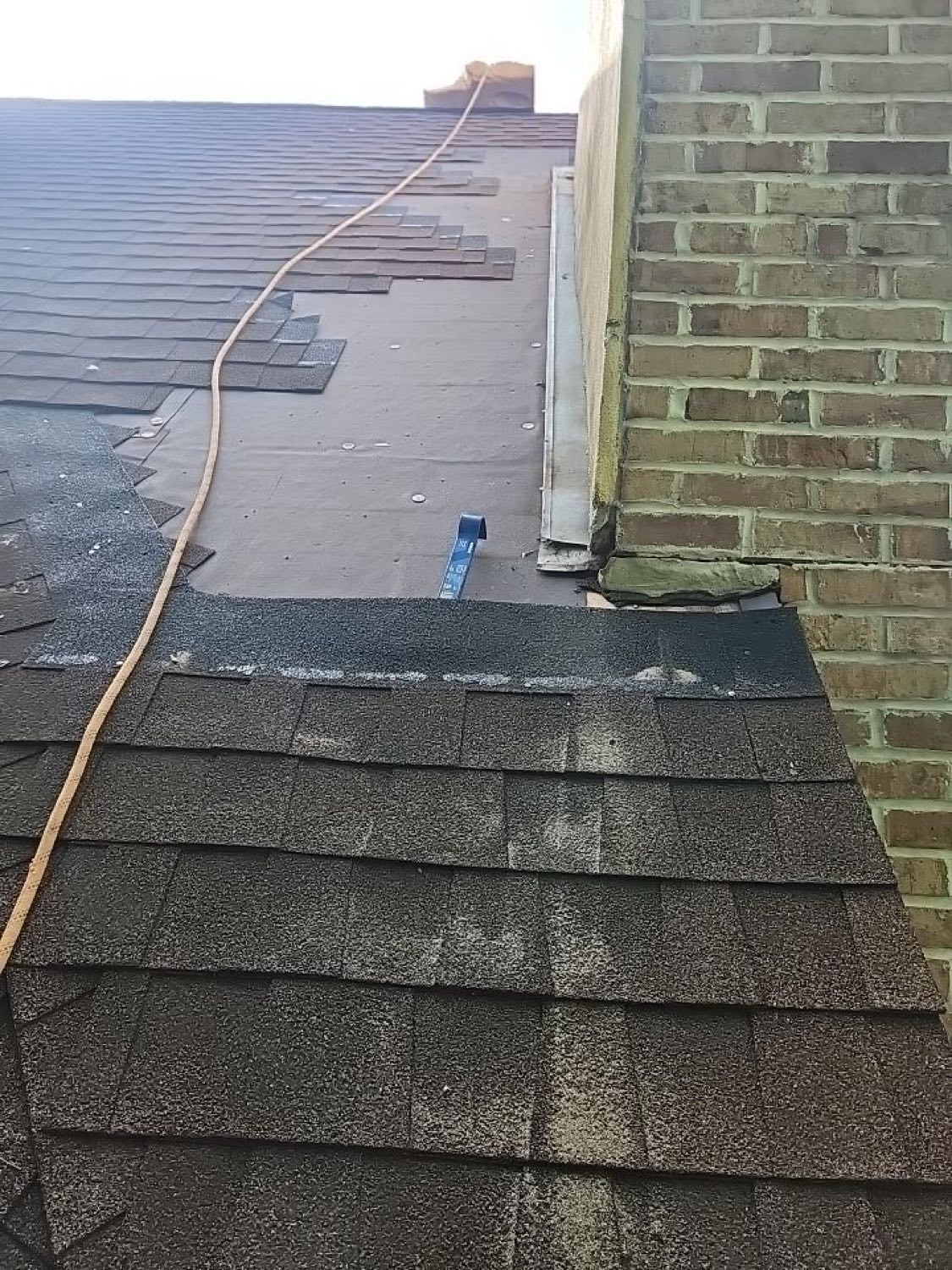 Improper chimney flashing found during a Gulf South Roofing inspection