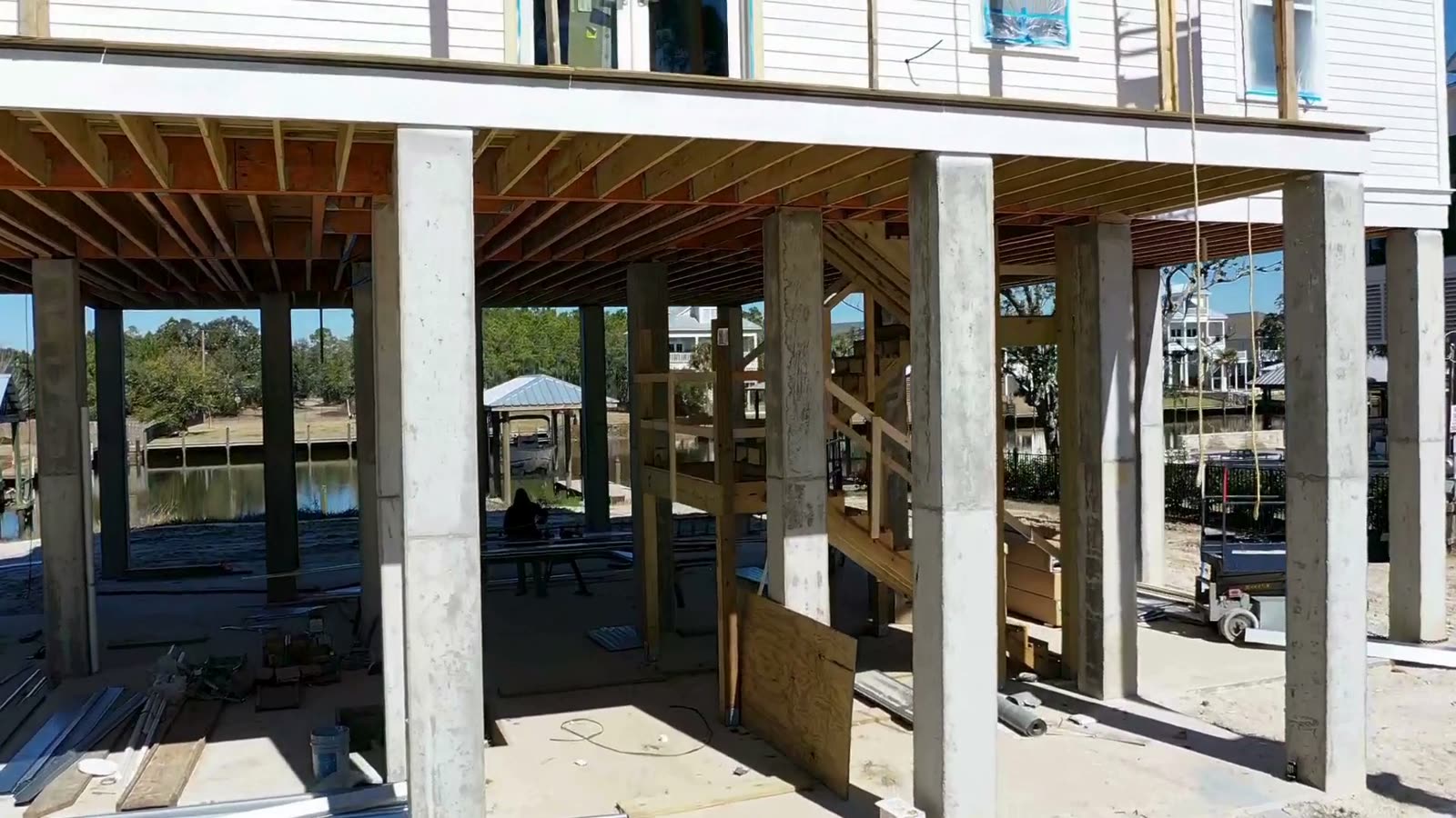 Gulf South Roofing crew installing a roof system on a waterfront Gulf Coast home