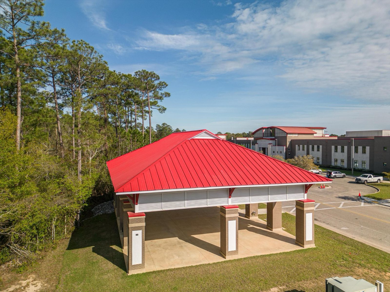 Standing seam metal roof on a Biloxi Mississippi beachfront pavilion built by Gulf South Roofing, photographed over the water
