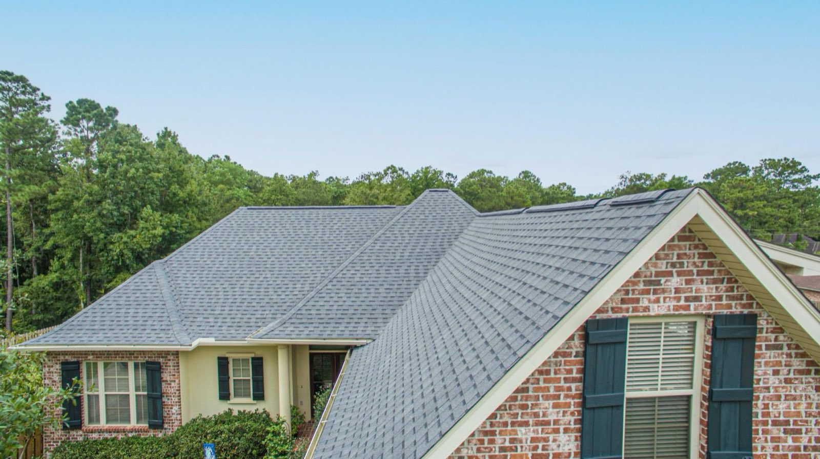 The shingle-to-membrane transition on a Diamondhead home rebuilt by Gulf South Roofing